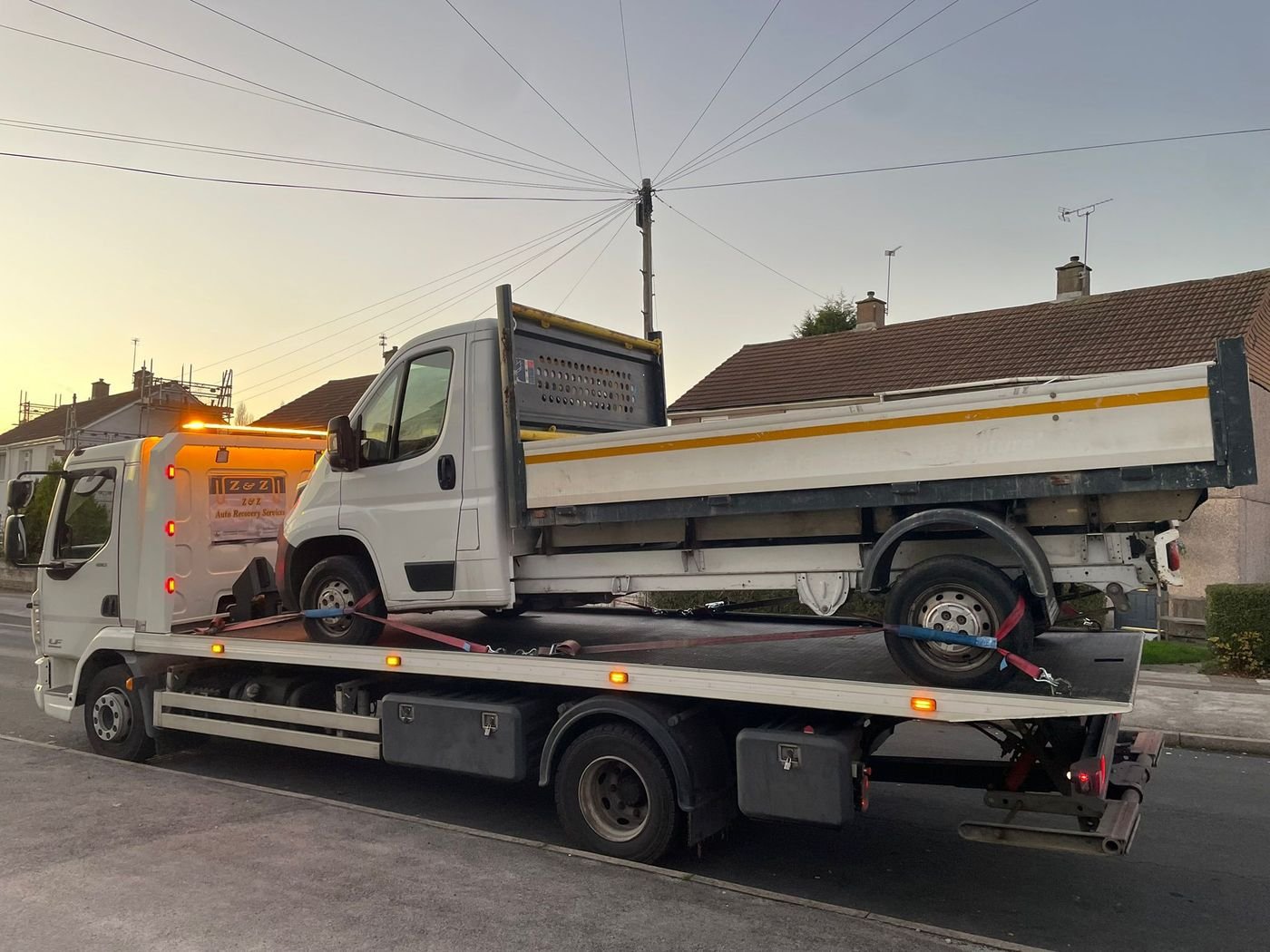 Z&Z Auto Recovery flatbed loading a vehicle for transport